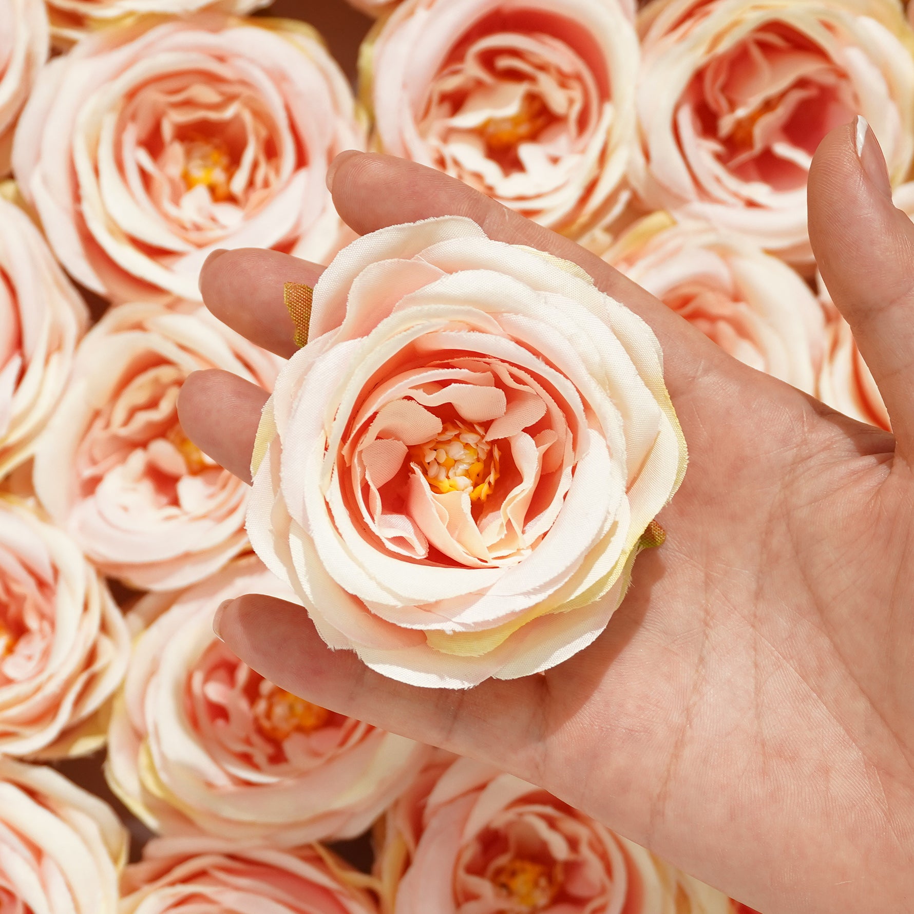 Faux rose blooms for photo booth flower backdrop
