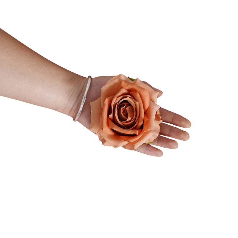 Assorted color artificial rose heads product flat lay