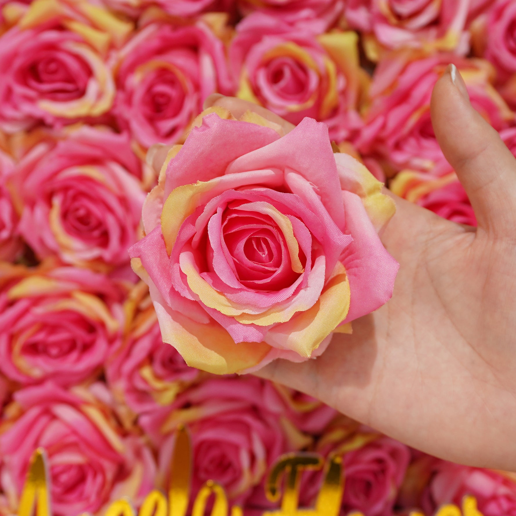 Hand‑held artificial rose head sample
