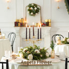 Glitter gold Christmas baubles nestled in faux greenery table wreath