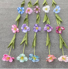 pastel‑pink‑purple‑fake‑tulip‑bloom‑with‑green‑leaves