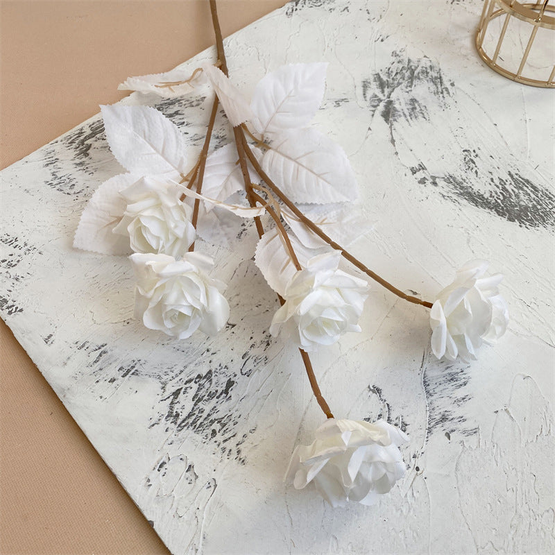 white-faux-rose-branch-with-leaves
