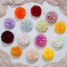 multicolor‑artificial‑chrysanthemum‑flower‑heads‑flat‑lay‑studio‑shot