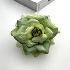 artificial-rose-head-flat-lay-photo
