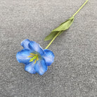 white‑fake‑tulip‑bloom‑branch‑home‑table‑arrangement