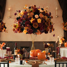 Vintage halloween tablescape with artificial fall flowers