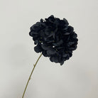 deep‑magenta‑fake‑hydrangea‑bloom‑textured‑petal‑closeup