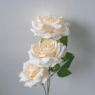 artificial‑rose‑flower‑spray‑green‑foliage‑closeup
