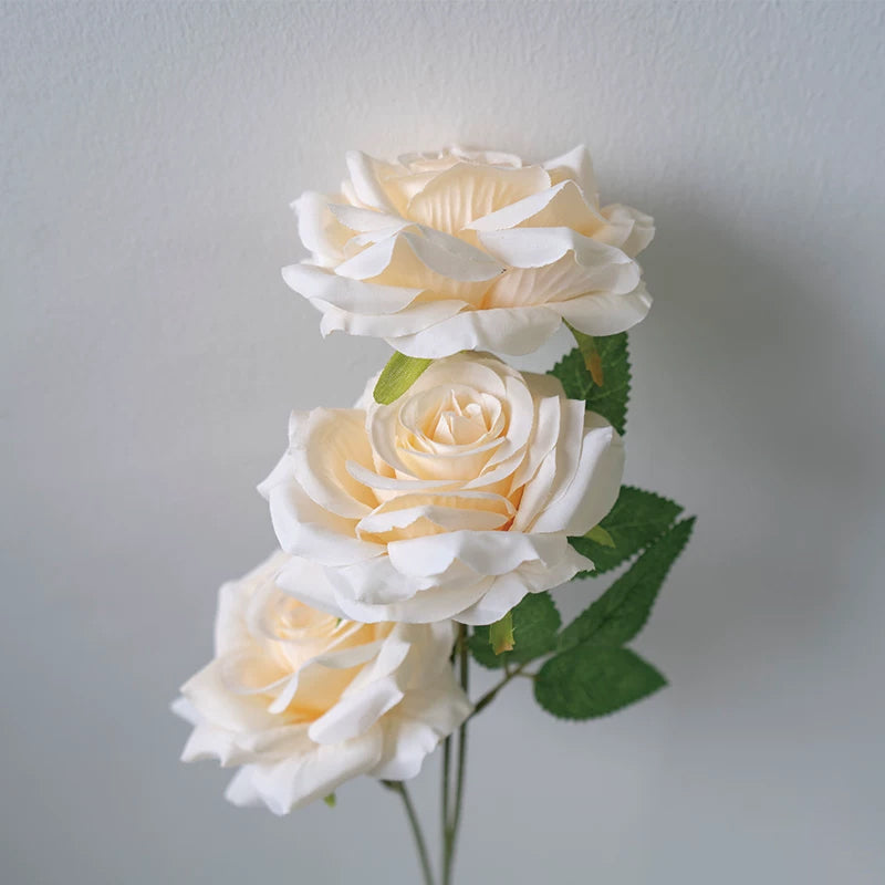 artificial‑rose‑flower‑spray‑green‑foliage‑closeup
