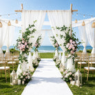 Soft pink hanging floral swag garden wedding
