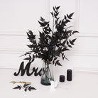 Combined black rose blooms and dark foliage stems set
