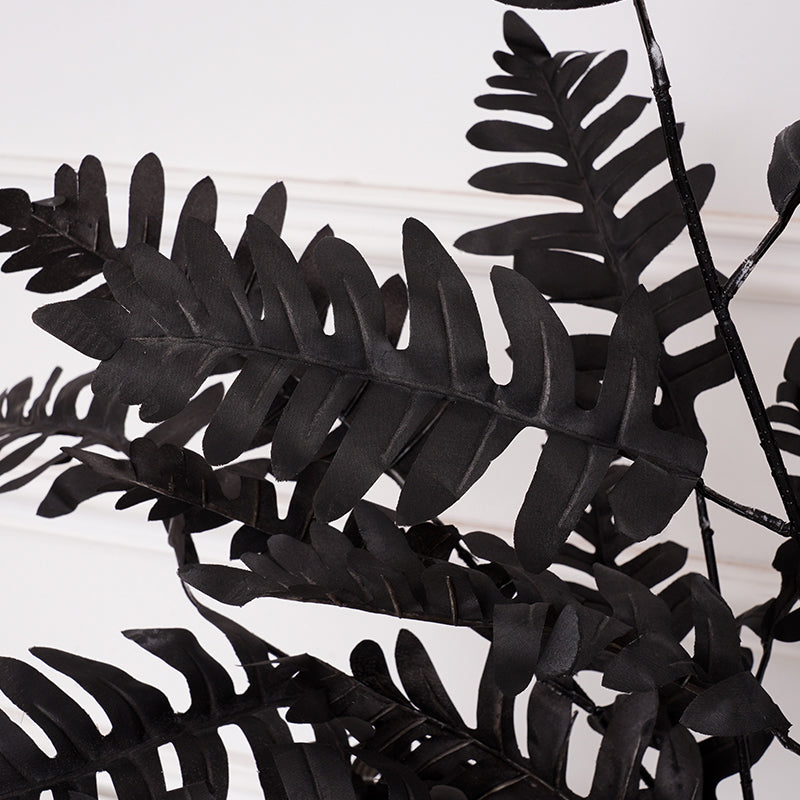 Moody table styling with mixed black artificial flowers