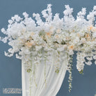 Blossom arch product photo against solid blue background
