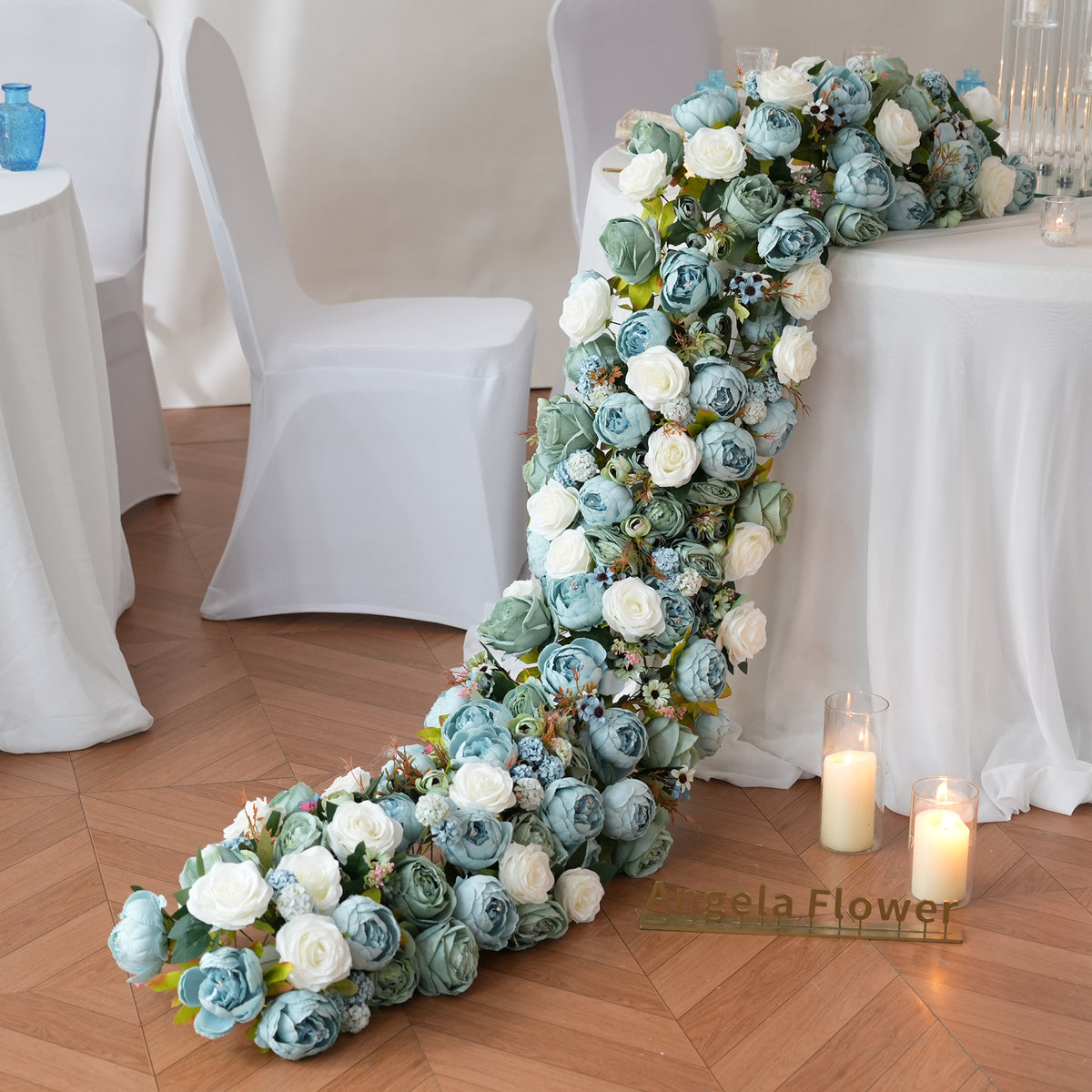 blue faux floral centerpiece for long wedding table