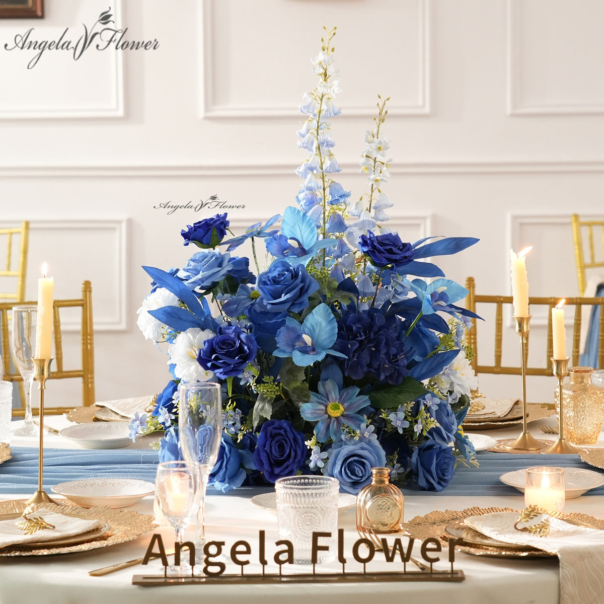 Deep blue mixed faux flower table centerpiece for wedding reception styling