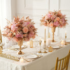 Round wedding table blush flower centerpiece with gold accents