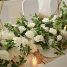 Matching flower row and tall flower ball centerpiece for wedding reception