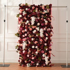 Burgundy flower wall with blush and white flower accents
