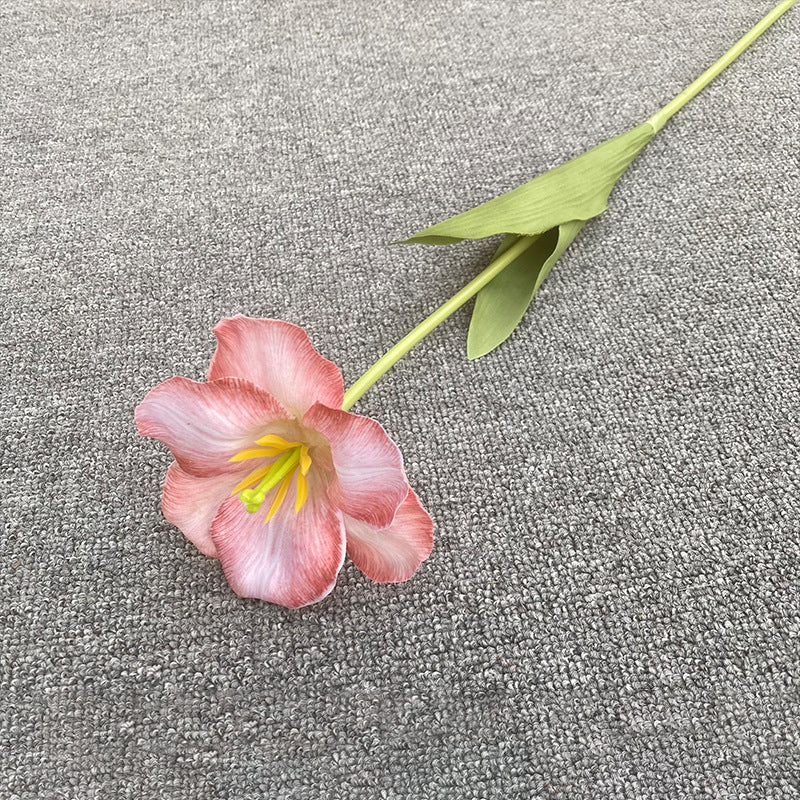 assorted‑color‑faux‑tulip‑stems‑grey‑carpet‑flat‑lay