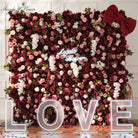 Burgundy and blush artificial flower wall backdrop for wedding photo booth