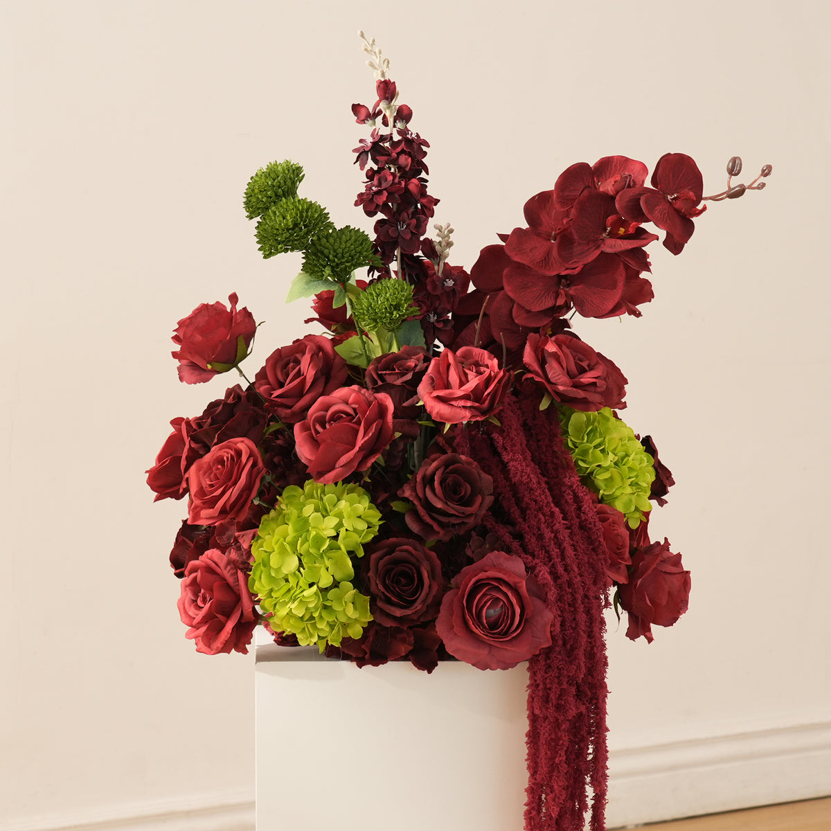 Burgundy and lime green wedding floor flower arrangement with trailing amaranthus
