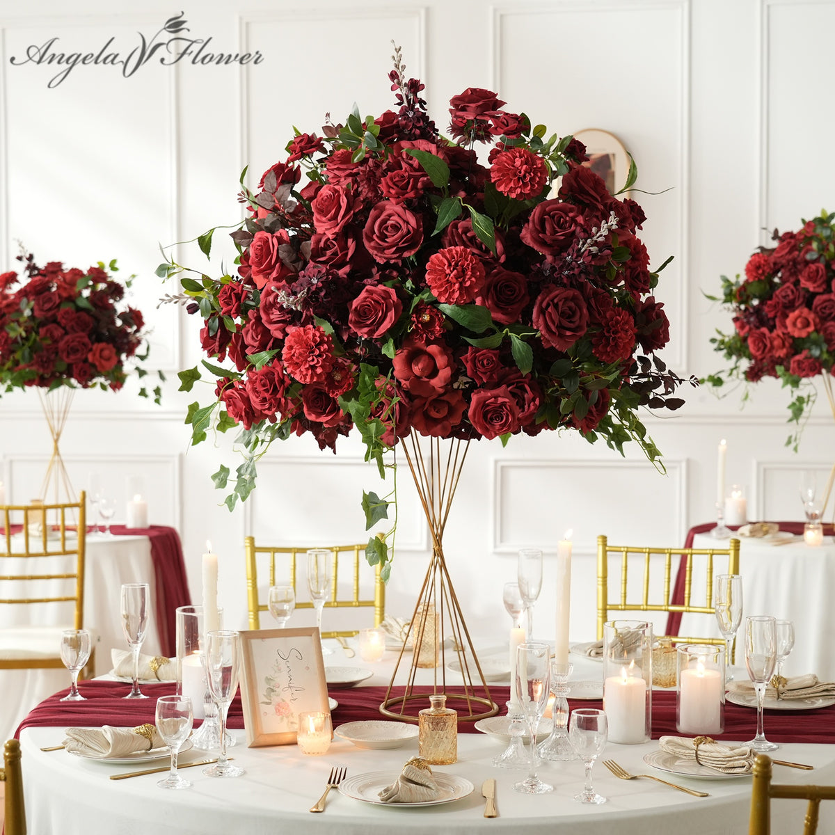 Lush burgundy artificial wedding tall table centerpiece, deep red silk roses dahlia with cascading ivy greenery for reception decor