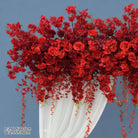 red wisteria cascading arch with sheer drape