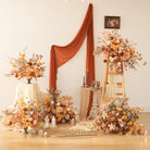 Rust orange faux flower backdrop hanging swag for wedding ceremony