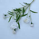 soft‑blush‑pink‑artificial‑carnation‑branches‑top‑down‑studio‑view