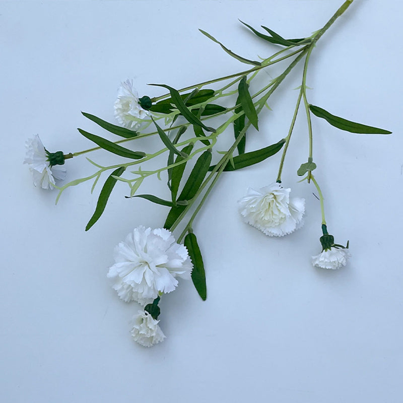soft‑blush‑pink‑artificial‑carnation‑branches‑top‑down‑studio‑view