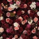Burgundy floral backdrop paired with pillar candle decor