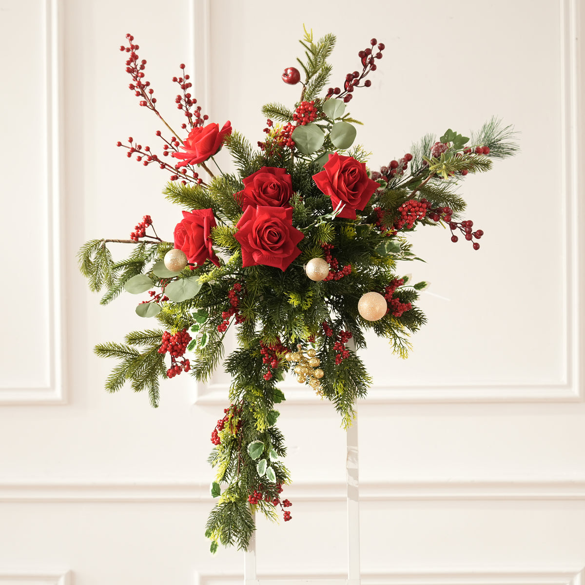 All components view of christmas floral set including arch swags, table florals and metal hoop frame