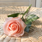 artificial-roses-on-window-table-decoration