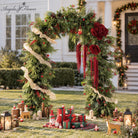 Artificial christmas arch floral set with frosted pine, red berries and pinecones for front yard decor