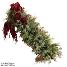 Outdoor lawn christmas arch display with gift boxes, reindeer decor and winter florals