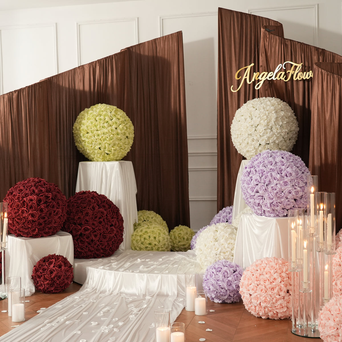 White rose spheres decorating chateau wedding walkway