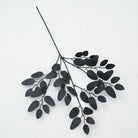 Isolated dark artificial leaves single stem product shot