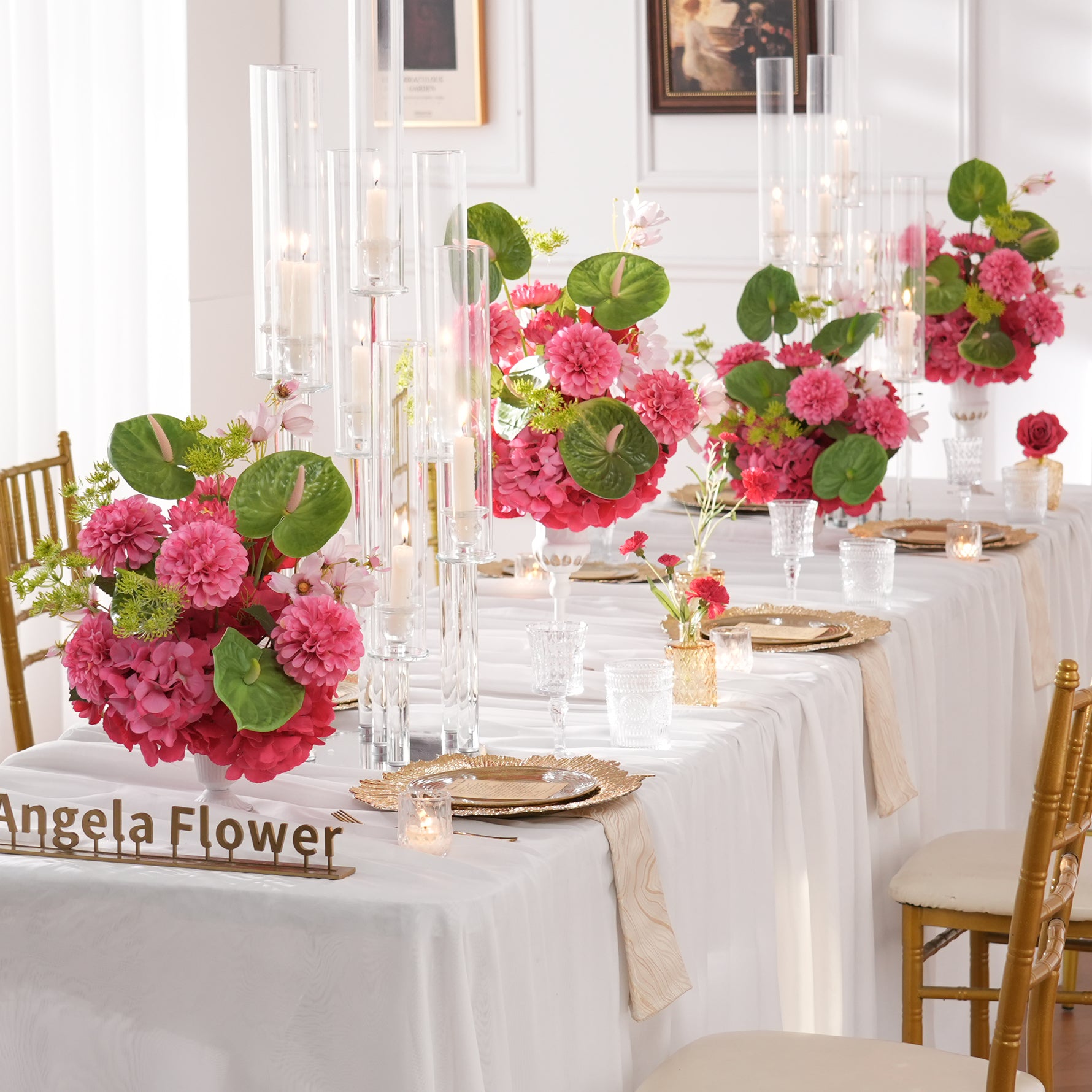 single‑pink‑artificial‑table‑centerpiece‑close‑up‑wedding‑reception‑scene