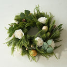 Luxury outdoor Christmas tablescape with floral table wreath