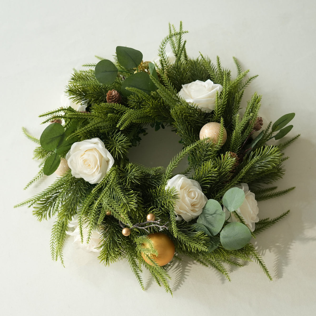 Luxury outdoor Christmas tablescape with floral table wreath