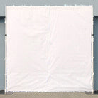 White fabric liner back view of faux flower wall panel