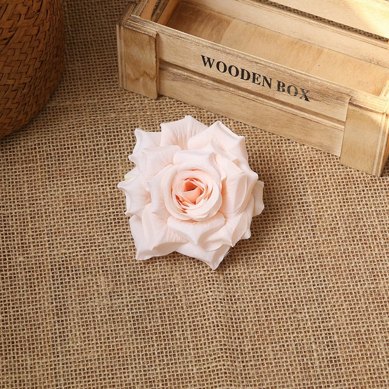 Faux silk rose flower head 