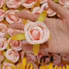 artificial‑rose‑flower‑heads‑white‑lace‑background