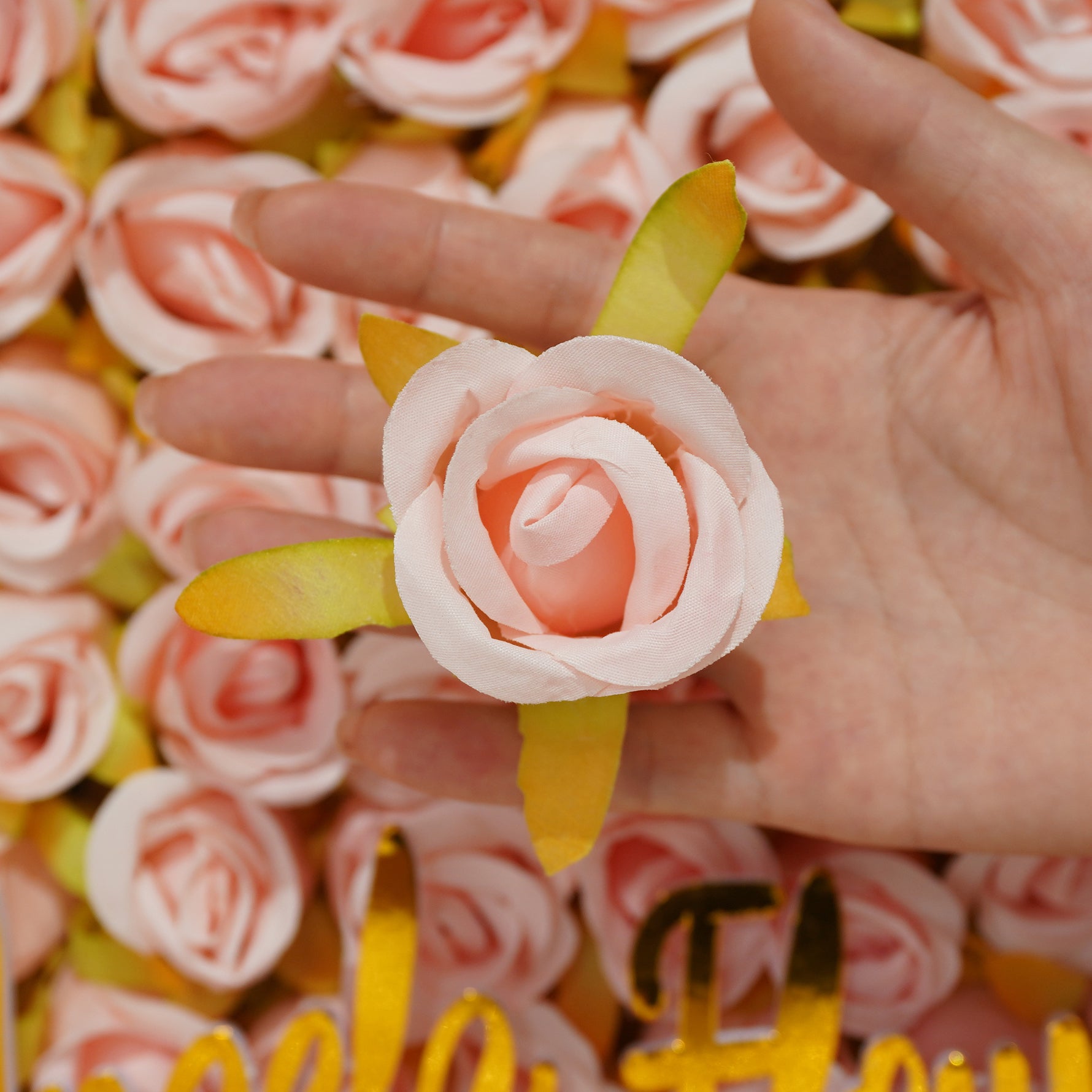 artificial‑rose‑flower‑heads‑white‑lace‑background