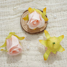 pink‑fake‑rose‑flower‑heads‑table‑decor