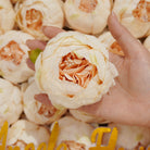 Baby pink faux ranunculus wedding blooms
