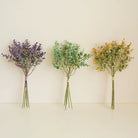 mixed‑color-faux-eucalyptus-bundles-wall-background

