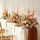 Elegant wedding head table faux flower decor with peach roses, delphinium