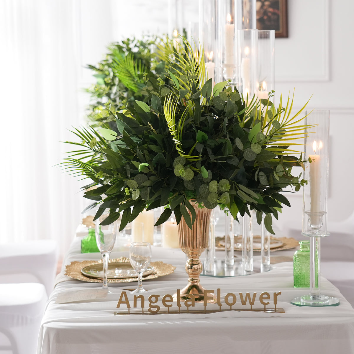Bulk all-green faux table centerpieces for professional wedding event planners