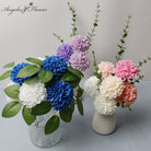 multicolor‑artificial‑pom‑pom‑hydrangea‑flower‑stems‑flat‑lay